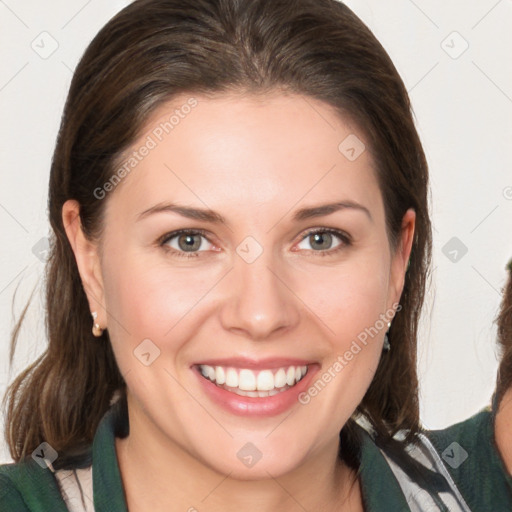 Joyful white young-adult female with medium  brown hair and green eyes