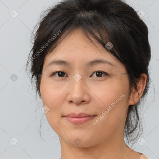 Joyful asian young-adult female with medium  brown hair and brown eyes