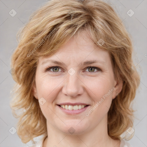 Joyful white young-adult female with medium  brown hair and blue eyes