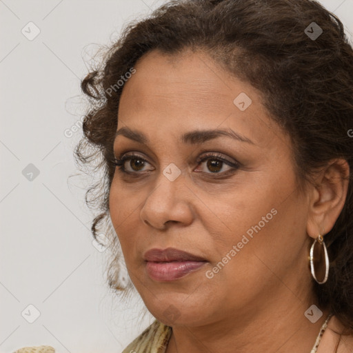 Joyful white adult female with long  brown hair and brown eyes