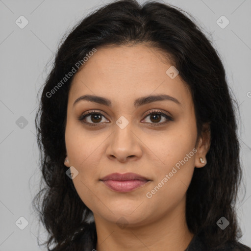 Joyful latino young-adult female with long  brown hair and brown eyes