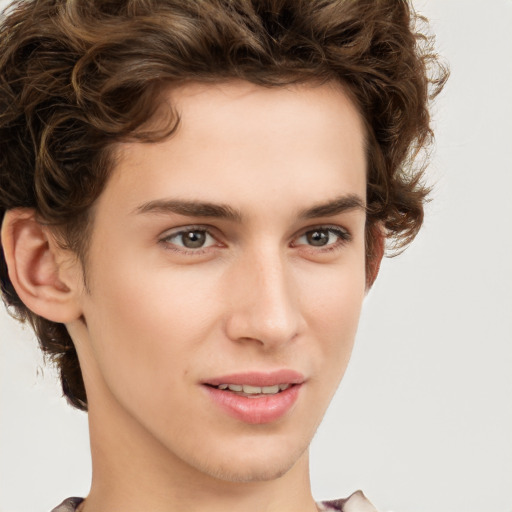 Joyful white young-adult male with medium  brown hair and brown eyes