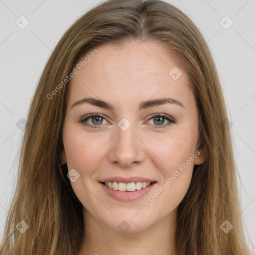 Joyful white young-adult female with long  brown hair and green eyes