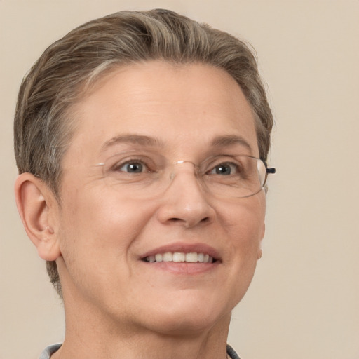 Joyful white adult female with short  brown hair and grey eyes