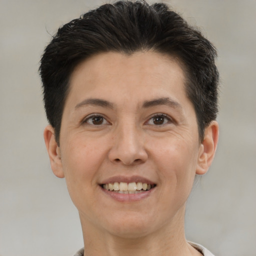Joyful white adult female with short  brown hair and brown eyes