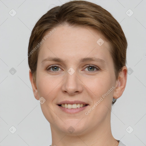 Joyful white young-adult female with short  brown hair and grey eyes