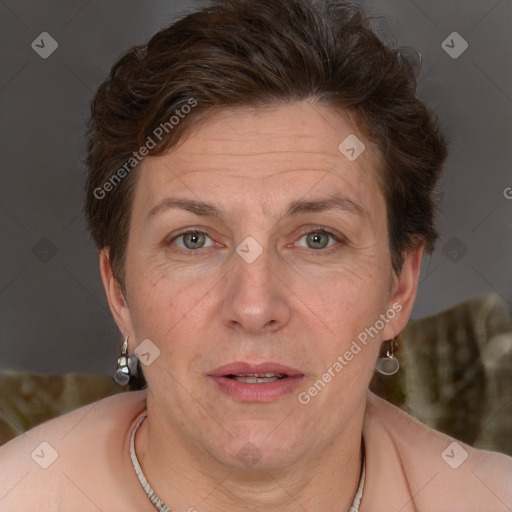 Joyful white adult female with short  brown hair and grey eyes