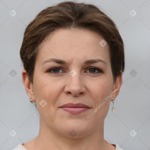 Joyful white adult female with short  brown hair and grey eyes