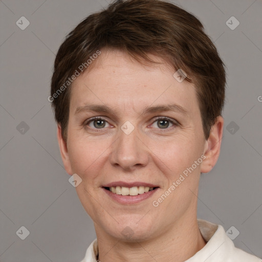 Joyful white adult female with short  brown hair and grey eyes