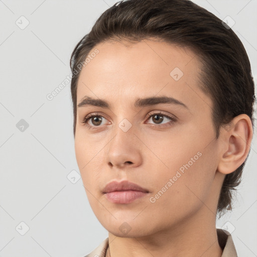 Neutral white young-adult female with short  brown hair and brown eyes