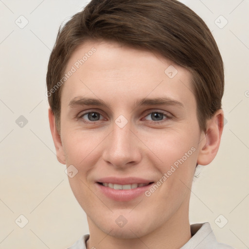 Joyful white young-adult female with short  brown hair and grey eyes