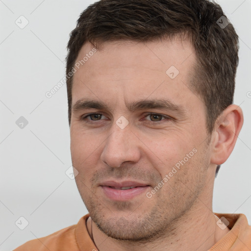 Joyful white young-adult male with short  brown hair and brown eyes