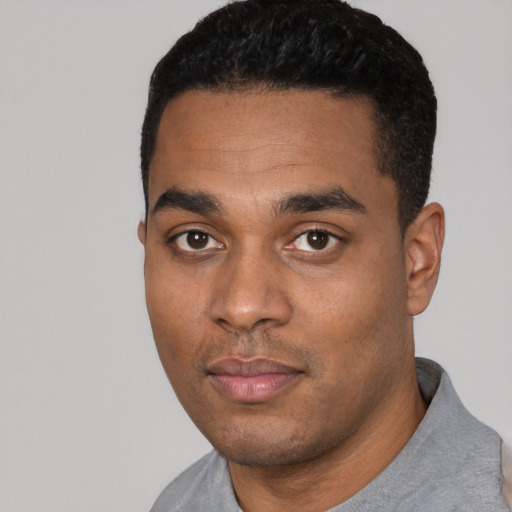 Neutral black young-adult male with short  black hair and brown eyes