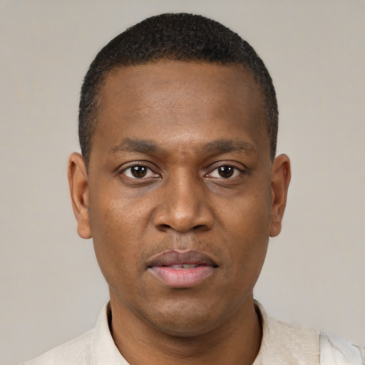 Neutral black young-adult male with short  brown hair and brown eyes