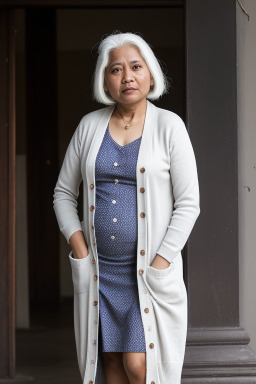 Nepalese 45 years female with  white hair