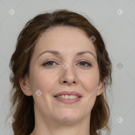 Joyful white adult female with medium  brown hair and grey eyes