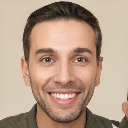 Joyful white young-adult male with short  brown hair and brown eyes