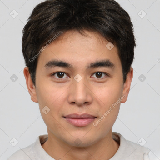 Joyful asian young-adult male with short  brown hair and brown eyes