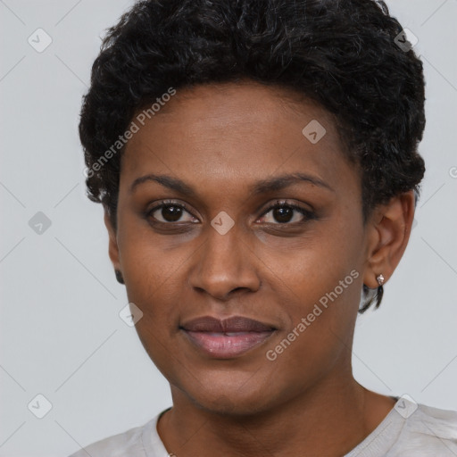 Joyful black young-adult female with short  black hair and brown eyes