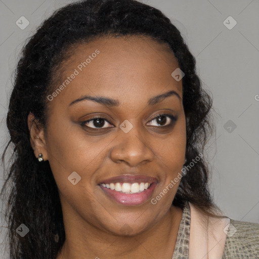 Joyful black young-adult female with long  brown hair and brown eyes