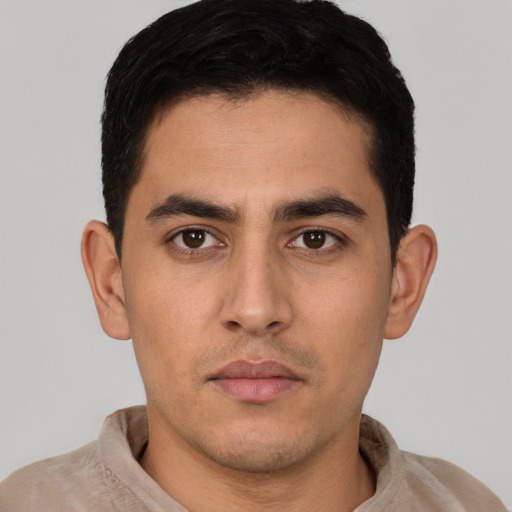 Neutral white young-adult male with short  black hair and brown eyes