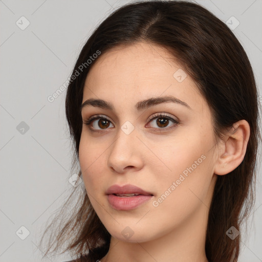 Neutral white young-adult female with long  brown hair and brown eyes