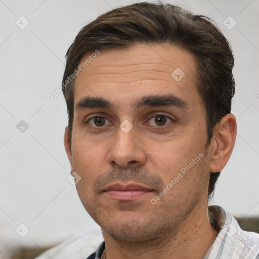 Joyful white adult male with short  brown hair and brown eyes