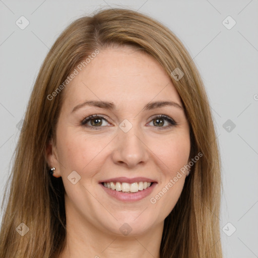 Joyful white young-adult female with long  brown hair and green eyes