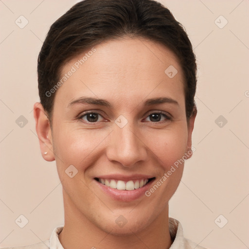 Joyful white young-adult female with short  brown hair and brown eyes