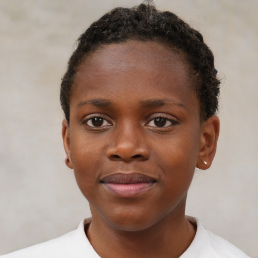 Joyful black child female with short  brown hair and brown eyes