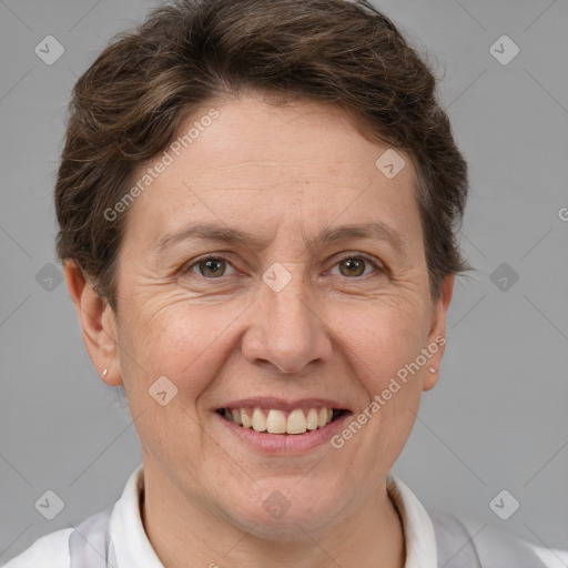 Joyful white adult female with short  brown hair and brown eyes