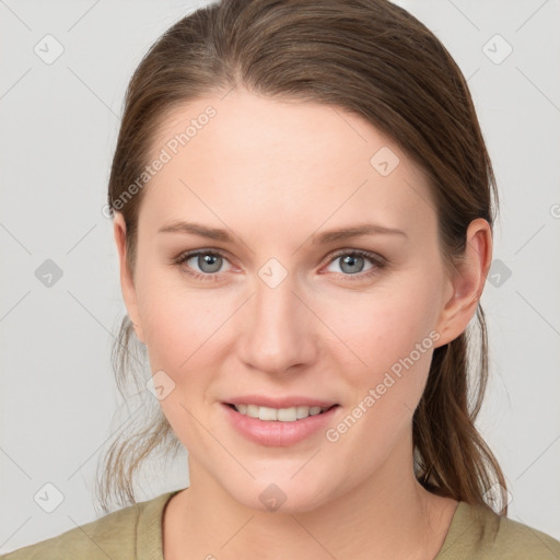 Joyful white young-adult female with medium  brown hair and grey eyes