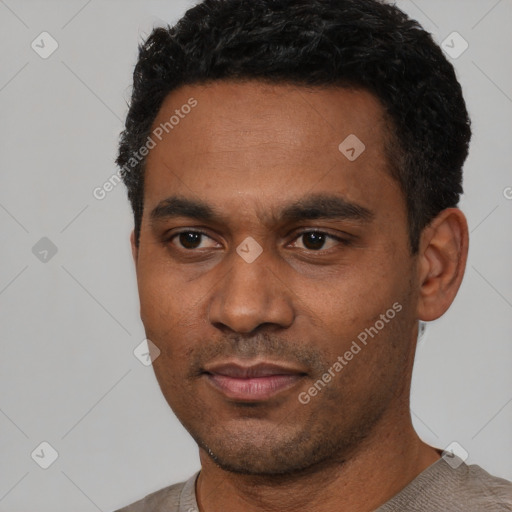 Neutral latino young-adult male with short  black hair and brown eyes