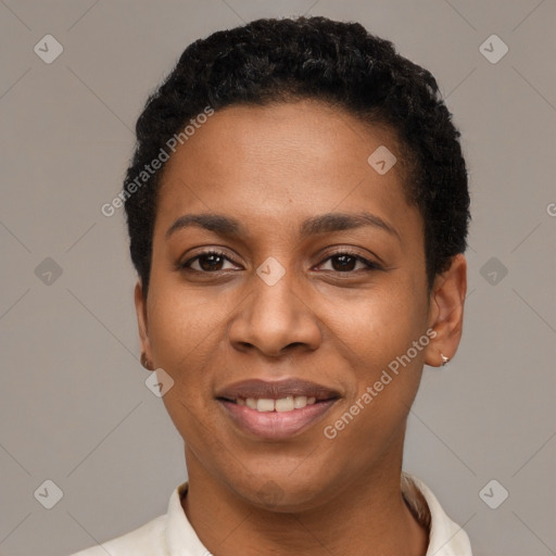 Joyful black young-adult female with short  black hair and brown eyes