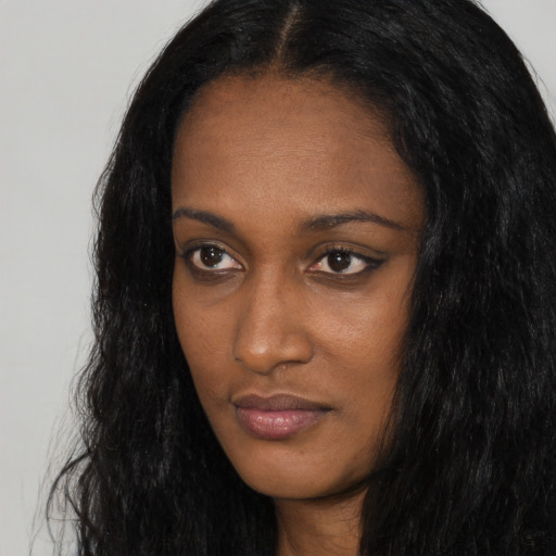 Neutral black young-adult female with long  black hair and brown eyes