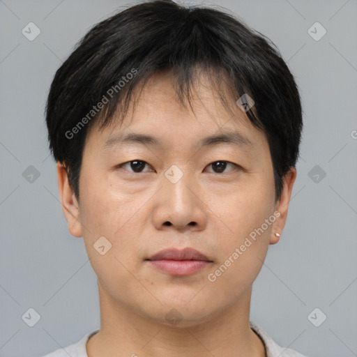 Neutral asian young-adult male with short  brown hair and brown eyes