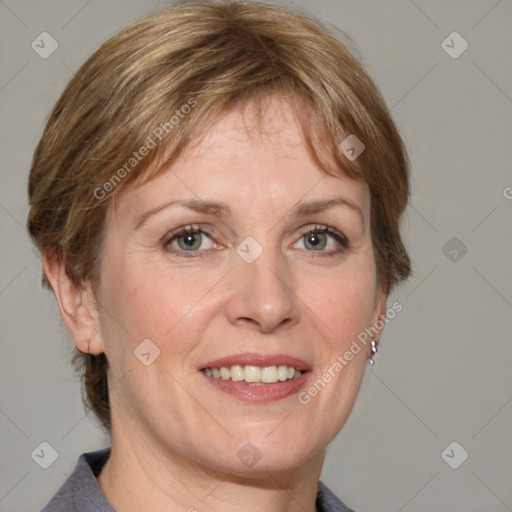 Joyful white adult female with medium  brown hair and grey eyes