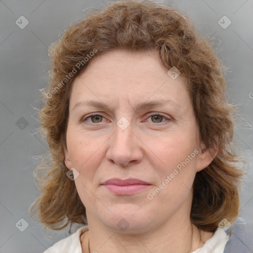 Joyful white adult female with medium  brown hair and blue eyes