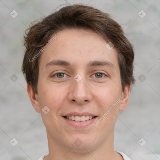 Joyful white adult male with short  brown hair and grey eyes