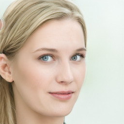 Joyful white young-adult female with long  brown hair and blue eyes