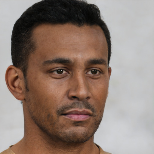 Neutral latino young-adult male with short  brown hair and brown eyes