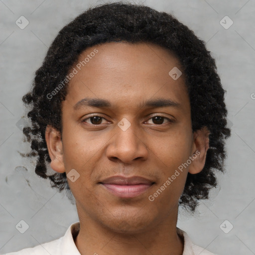 Joyful black young-adult male with short  brown hair and brown eyes