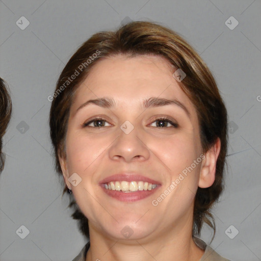 Joyful white adult female with medium  brown hair and brown eyes