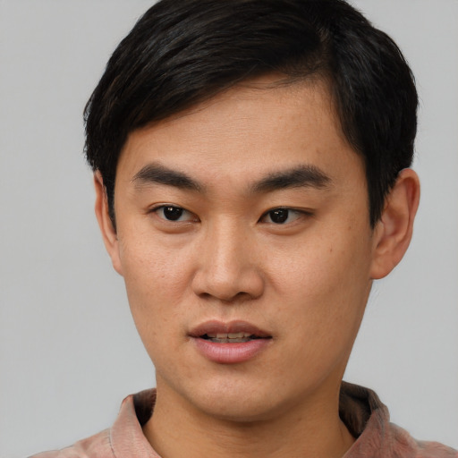 Neutral asian young-adult male with short  brown hair and brown eyes