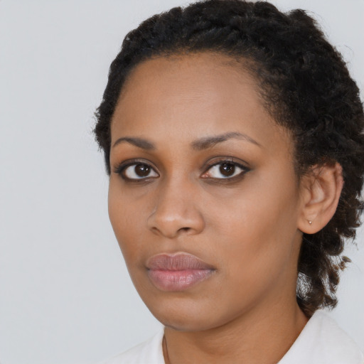 Neutral black young-adult female with medium  black hair and brown eyes