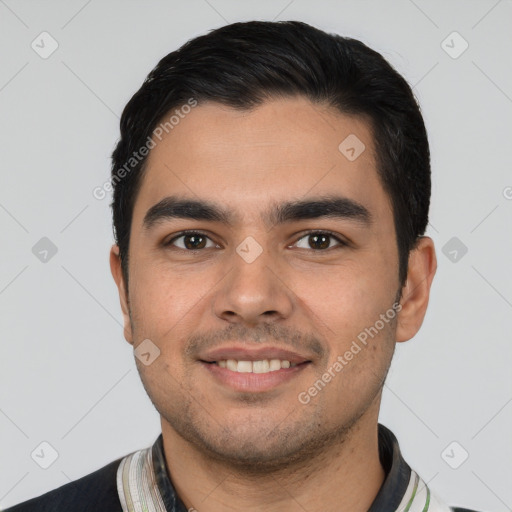 Joyful white young-adult male with short  black hair and brown eyes