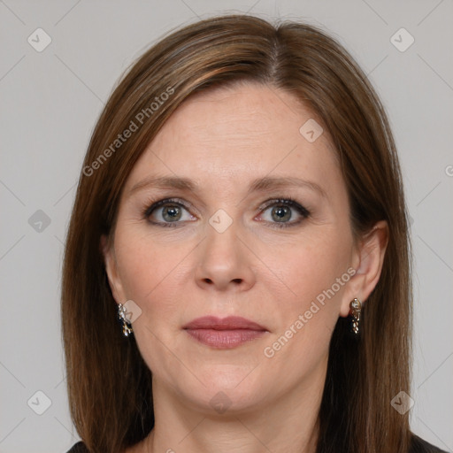 Joyful white adult female with medium  brown hair and grey eyes