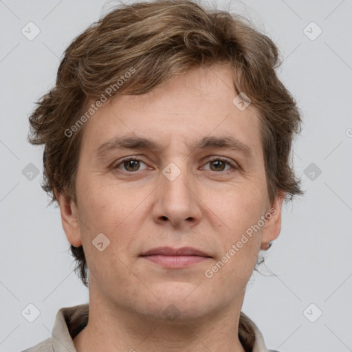 Joyful white adult male with short  brown hair and grey eyes