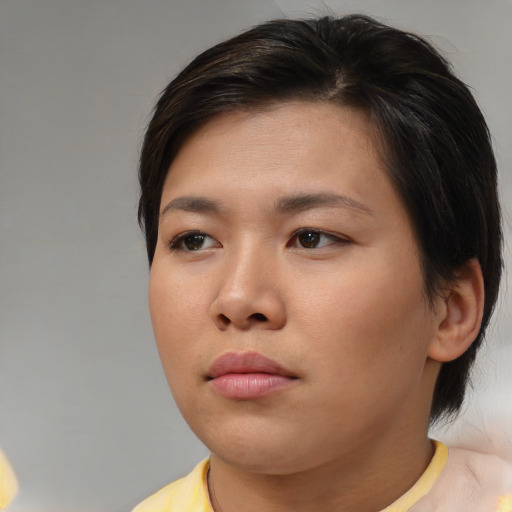 Neutral asian young-adult female with medium  brown hair and brown eyes