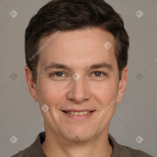 Joyful white adult male with short  brown hair and grey eyes